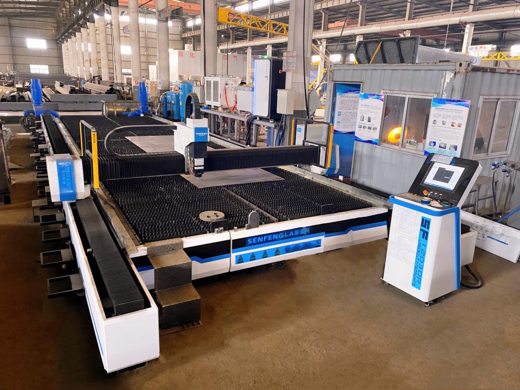 CNC fiber laser cutting steel plate in the TIANYU workshop