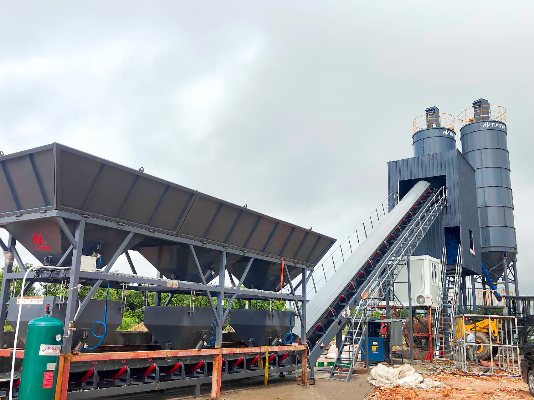 TIANYU stationary concrete batching plant — aggregate batcher, inclined belt, and silos